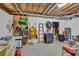 Unfinished basement featuring pegboard for tool storage and shelving at 3125 Flatbottom Dr, Dacula, GA 30019