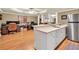 Basement area with a kitchenette, stainless steel appliances, and open-concept living space at 3125 Flatbottom Dr, Dacula, GA 30019