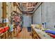 Unfinished basement workshop space with tools, equipment, and shelving at 3125 Flatbottom Dr, Dacula, GA 30019