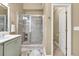 Bathroom featuring a vanity with solid surface countertops and glass-enclosed shower at 3125 Flatbottom Dr, Dacula, GA 30019