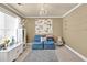 Bedroom with a large window, chandelier lighting, seating and flower themed decor at 3125 Flatbottom Dr, Dacula, GA 30019