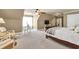 Spacious bedroom features neutral carpet, sitting area, and a ceiling fan at 3125 Flatbottom Dr, Dacula, GA 30019