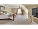 Spacious bedroom with lounge area, ceiling fan, and window providing ample natural light at 3125 Flatbottom Dr, Dacula, GA 30019