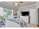 Comfortable bedroom with a large window, white furniture, soft carpet, and neutral walls for a relaxing atmosphere at 3125 Flatbottom Dr, Dacula, GA 30019