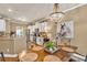 Dining area with stylish chandelier and adjacent kitchen with stainless appliances at 3125 Flatbottom Dr, Dacula, GA 30019