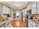 Well-equipped kitchen features granite countertops, stainless steel appliances and ample cabinet space at 3125 Flatbottom Dr, Dacula, GA 30019