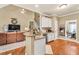 Open-concept kitchen with breakfast bar and views of living and dining areas at 3125 Flatbottom Dr, Dacula, GA 30019