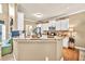 Bright kitchen featuring white cabinets, granite countertops, stainless appliances and hardwood floors at 3125 Flatbottom Dr, Dacula, GA 30019