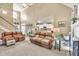 Cozy living area featuring high ceilings, a fireplace, a staircase and an open design layout with an eat in kitchen at 3125 Flatbottom Dr, Dacula, GA 30019