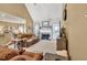 Inviting living room with plush leather seating, a cozy fireplace, and neutral tones at 3125 Flatbottom Dr, Dacula, GA 30019