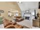 Inviting living room with plush leather seating, a cozy fireplace, and neutral tones at 3125 Flatbottom Dr, Dacula, GA 30019