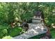 An aerial view of a two-story home surrounded by lush greenery and a curved driveway at 4627 Angelo Ne Dr, Atlanta, GA 30319