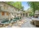 A stone pool, patio, and fireplace blend to create a perfect outdoor living space at 4627 Angelo Ne Dr, Atlanta, GA 30319