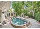 An in-ground pool, patio, and stone fireplace create the perfect outdoor oasis at 4627 Angelo Ne Dr, Atlanta, GA 30319