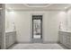 An open-concept bathroom featuring marble floors and double vanities at 4627 Angelo Ne Dr, Atlanta, GA 30319