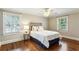 Comfortable bedroom with hardwood floors, windows with blinds and overhead fan at 4627 Angelo Ne Dr, Atlanta, GA 30319
