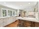 Bright kitchen with white cabinetry, island, and stainless steel appliances at 4627 Angelo Ne Dr, Atlanta, GA 30319