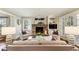 Warm living room with stone fireplace and a wall of windows at 4627 Angelo Ne Dr, Atlanta, GA 30319