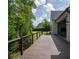 Spacious backyard deck showcasing wooden flooring with scenic views, perfect for outdoor relaxation and enjoyment at 464 Pine Tree Ne Dr, Atlanta, GA 30305