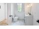 This bathroom features a toilet, and vanity with white countertop and black hardware at 464 Pine Tree Ne Dr, Atlanta, GA 30305