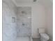 Bathroom featuring tile shower with shower niche and modern fixtures at 464 Pine Tree Ne Dr, Atlanta, GA 30305