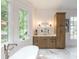 Bright bathroom featuring luxurious marble floors, double windows, and beautiful cabinetry in a well-lit space at 464 Pine Tree Ne Dr, Atlanta, GA 30305