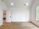 Bright bedroom with hardwood floors, white walls, and a window at 464 Pine Tree Ne Dr, Atlanta, GA 30305