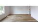 Bright bedroom featuring light hardwood floors, white walls and a large window to bring in natural light at 464 Pine Tree Ne Dr, Atlanta, GA 30305