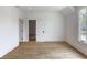 Bright bedroom with hardwood floors, white walls, and a window at 464 Pine Tree Ne Dr, Atlanta, GA 30305