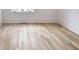 Bedroom features hardwood floors, a large window with trim, and white walls at 464 Pine Tree Ne Dr, Atlanta, GA 30305