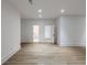 Spacious bedroom features wood floors and neutral paint, leading to attached bathroom via doorway at 464 Pine Tree Ne Dr, Atlanta, GA 30305