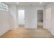 Bright bedroom features hardwood floors, white walls, and natural light from window, creating a relaxing space at 464 Pine Tree Ne Dr, Atlanta, GA 30305