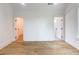 Bright bedroom with hardwood floors, white walls, and two doors at 464 Pine Tree Ne Dr, Atlanta, GA 30305