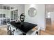 Stylish dining room with modern light fixture and sliding doors to the outdoor at 464 Pine Tree Ne Dr, Atlanta, GA 30305