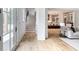 Inviting entryway featuring hardwood floors, staircase, and open access to the kitchen at 464 Pine Tree Ne Dr, Atlanta, GA 30305