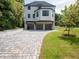 Beautiful three-story home with a three-car garage and neatly landscaped yard at 464 Pine Tree Ne Dr, Atlanta, GA 30305