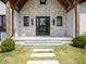 Inviting front porch with stone accents and a stylish entryway at 464 Pine Tree Ne Dr, Atlanta, GA 30305