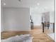 Hallway boasts hardwood floors, modern railings, and an open, airy layout at 464 Pine Tree Ne Dr, Atlanta, GA 30305