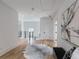 Hallway featuring hardwood floors, contemporary art, and modern railings at 464 Pine Tree Ne Dr, Atlanta, GA 30305
