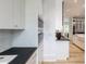Bright, modern kitchen featuring sleek white cabinetry and stainless steel appliances at 464 Pine Tree Ne Dr, Atlanta, GA 30305