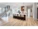Open-concept kitchen with hardwood floors, stainless steel appliances, and a large center island at 464 Pine Tree Ne Dr, Atlanta, GA 30305