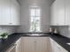 Well-lit kitchen features white cabinets and lots of counter space at 464 Pine Tree Ne Dr, Atlanta, GA 30305