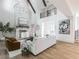 Spacious living room features soaring ceilings, a stone fireplace, and natural light throughout at 464 Pine Tree Ne Dr, Atlanta, GA 30305