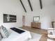 Bright primary bedroom with high ceilings, exposed beams, and hardwood floors at 464 Pine Tree Ne Dr, Atlanta, GA 30305