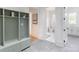 This mudroom features a custom built-in locker system, tile floors and bright white trim at 464 Pine Tree Ne Dr, Atlanta, GA 30305