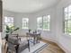 Bright office space with three large windows, modern decor, a work space, and comfortable seating at 464 Pine Tree Ne Dr, Atlanta, GA 30305