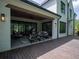 Charming outdoor patio with a ceiling fan, comfortable seating, and elegant lighting for entertaining at 464 Pine Tree Ne Dr, Atlanta, GA 30305