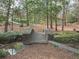 Stone bridge crossing a small stream offering a serene view of nature at 464 Pine Tree Ne Dr, Atlanta, GA 30305