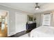 Comfortable bedroom with neutral walls, dark dresser, and view to the living room at 960 Lindridge Ne Dr, Atlanta, GA 30324