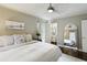 Bedroom featuring a large bed, natural light, and view to the bathroom at 960 Lindridge Ne Dr, Atlanta, GA 30324